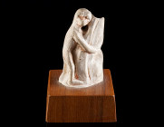 A SMALL EGYPTIAN LIMESTONE FIGURE OF A MONKEY New Kingdom, probably Amarna Period (circa 1353-1336 BC). A figure of a monkey possibly playing a harp. ...