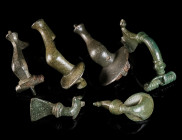 A GROUP OF SIX ROMAN BRONZE BROOCHES Circa 1st-3rd century AD. Various forms (three knee brooches, two strongly profiled brooches, and a trumpet brooc...