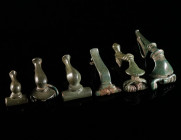 A GROUP OF SIX ROMAN BRONZE BROOCHES Circa 2nd-3rd century AD. Various forms (four knee brooches, a trumpet brooch, and a Noric-Pannonian brooch with ...