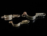 A GROUP OF THREE BYZANTINE BRONZE BROOCHES WITH BENT FOOT Circa 5th-6th century AD. Bow brooches with folded foot (umgeschlagenem Fuß) and incised dec...