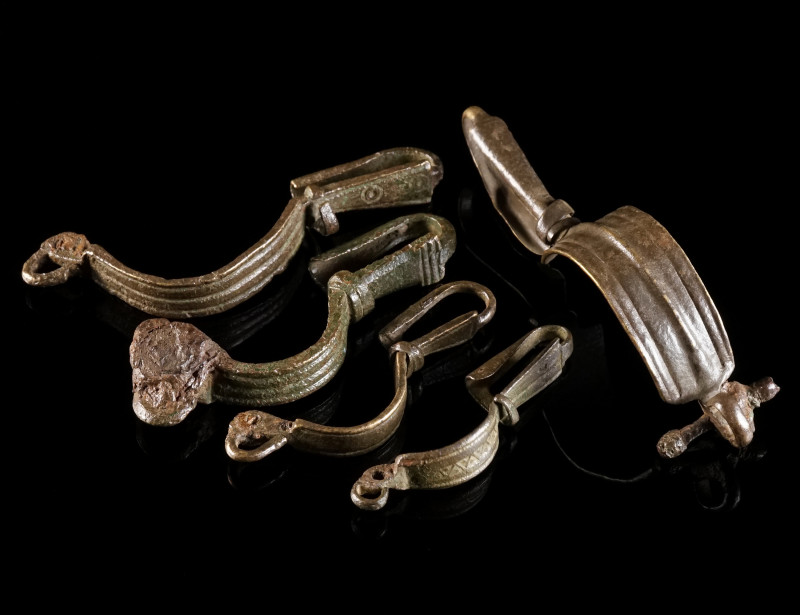 A GROUP OF FIVE BYZANTINE BRONZE BROOCHES WITH BENT FOOT Circa 5th-6th century A...