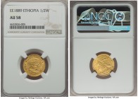 Menelik II gold 1/2 Werk EE 1889 (1896) AU58 NGC, KM17. A bright piece with few surface marks and an elegant amber toning near the edges.

HID99912102...