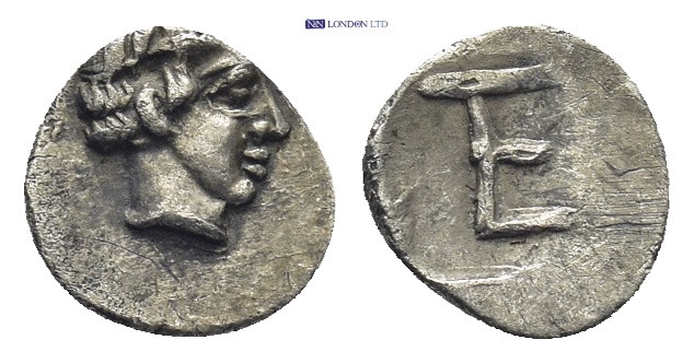 Ionia, Kolophon. AR Tetartemorion, (8mm, 0.32 g). Circa 450-410 BC. Obv: Laureat...