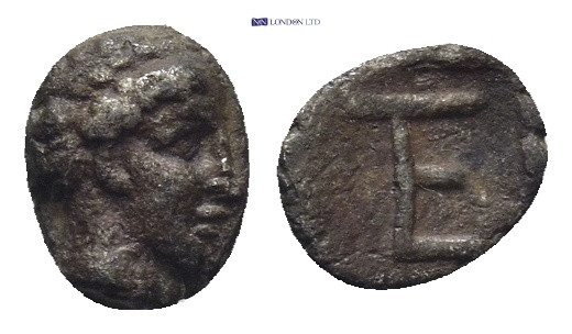 Ionia, Kolophon. AR Tetartemorion, (7mm, 0.29 g). Circa 450-410 BC. Obv: Laureat...