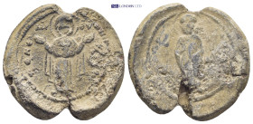 Byzantine lead seal (12Gr. 27mm.) Obv: MP - ΘV. Theotokos (Virgin Mary) standing facing, orans, holding medallion with Christ. Rev: Saint standing fac...