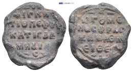 Byzantine lead seal (6.8Gr. 19mm.) Obv:Legend in four lines. Rev:Legend in four lines.