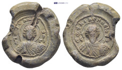 Byzantine lead seal (10.3Gr. 21mm.) Obv: Nimbate facing bust of Saint George, holding spear over his right shoulder and shield on his left arm. Rev: N...