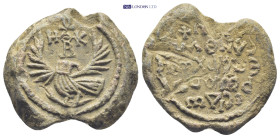 Byzantine Lead Seal (26mm, 18.48 gr) Obv: Eagle with uplifted wings and head turned to left. In field above head of eagle, cruciform invocative monogr...