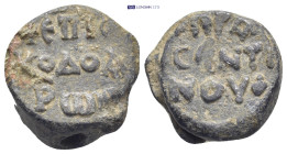 Byzantine lead seal (14.54Gr. 19mm.) Obv:Legend in three lines. Rev:Legend in three lines.