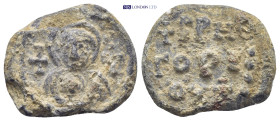 Byzantine lead seal (9.44Gr. 22mm.) Obc: Facing bust of the Virgin Mary, holding Christ; cross to left and right. Rev: Legend in three lines.