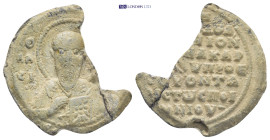 Byzantine Lead Seal (25mm, 7.19 gr) Obv: Bust of Saint facing, nimbate, raising his right hand in benediction and holding book of Gospels in his left....