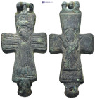 Byzantine Reliquary Cross Pendant. A bronze reliquary in form of a double cross, decorated in relief, crucified Christ to one side, the other with the...