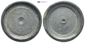 Byzantine circa AD 500-700. Weight AE (24.79 Gr. 28mm). 
Discoid coin-weight with centering hole, ΓΑ with scroll ornaments above and below 
Rev. Five ...