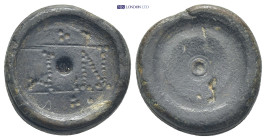 Byzantine circa AD 500-700. Weight AE (12.52 Gr. 20mm). 
Discoid coin-weight with centering hole, NΓ with scroll ornaments above and below 
Rev. Five ...