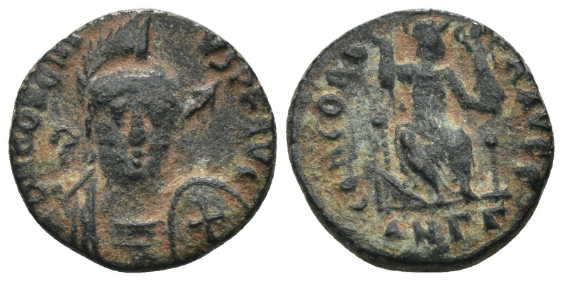 Honorius. (401-403 AD). Follis. Constantinople. Obv: DN HONORIVS PF AVG. helmete...