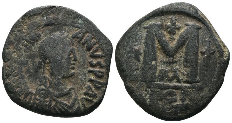 Justinian I. (527-565 AD) Æ 10 Nummi. Theoupolis. Obv: crowned bust facing. Rev:...