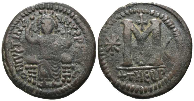 Justinian I. (527-565 AD) Follis. Theoupolis. Obv: Justinian sitting enthroned f...