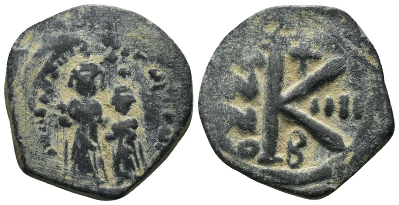 Phocas and Leonita. (602-610 AD) Æ 1/2 Follis. Obv: Phocas and Leonita standing ...