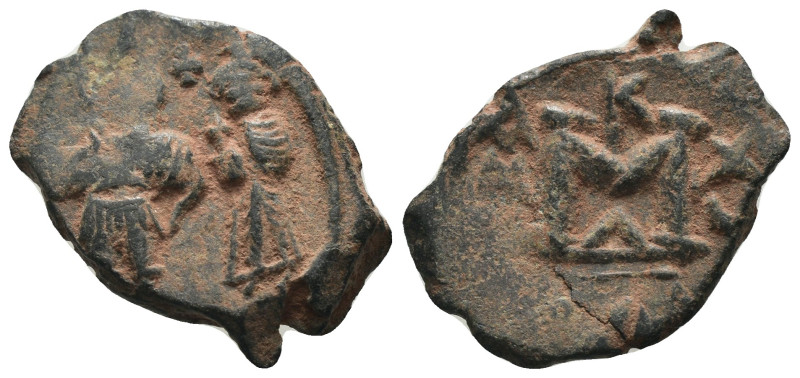 Phocas and Leonita. (602-610 AD) Æ Follis. Obv: Phocas and Leonita standing faci...