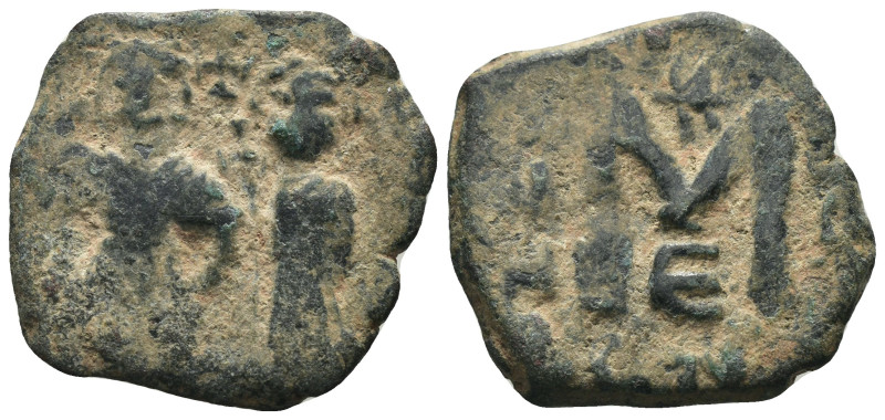 Phocas and Leonita. (602-610 AD) Æ Follis. Obv: Phocas and Leonita standing faci...