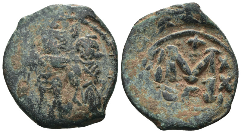 Phocas and Leonita. (602-610 AD) Æ Follis. Obv: Phocas and Leonita standing faci...