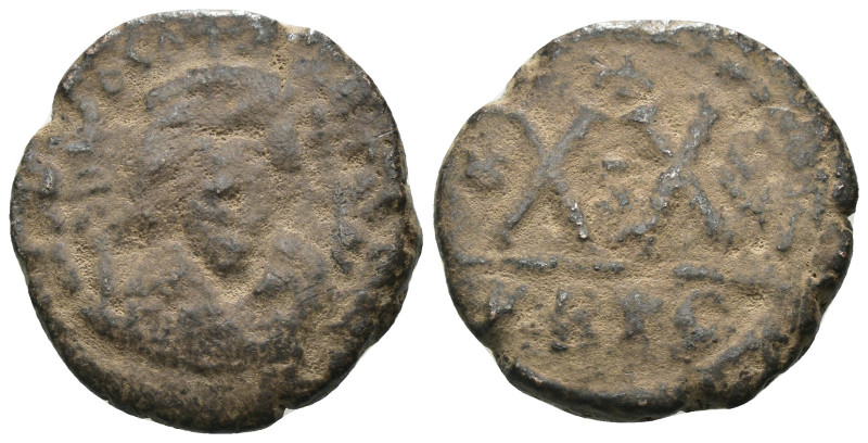 Phocas. (602-610 AD). 20 Nummi. Constantinople. Obv: crowned bust facing. Rev: d...