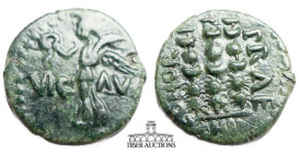 MACEDON, Philippi. Autonomous issue. Circa 1st Century AD. Æ 19. Victory standing left on base, holding wreath and palm / Three standards.  17 mm, 2.9...