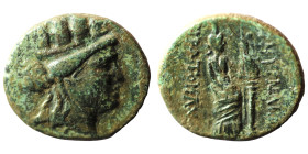 Ionia, Smyrna, c. 125-115 BC. ÆTurreted head of Tyche r. R/ Aphrodite Stratonikis standing r., resting arm on column, holding Nike; sceptre between Ap...