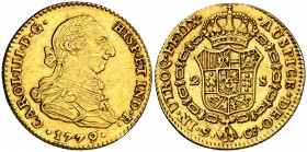 1779. Carlos III. Sevilla. CF. 2 escudos. (Cal. 580). 6,75 g. Leves rayitas. Golpecito en canto. Precioso color. Escasa y más así. (EBC).