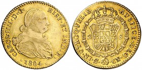 1804. Carlos IV. Sevilla. CN. 2 escudos. (Barrera falta). 6,64 g. Falsa de época en oro. MBC-/MBC.
