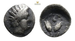 Greek Asia. Islands off Caria, Rhodes. AR Diobol, c. 300-250 BC. Obv. Radiate head of Helios right. Rev. P-O. Two rosebuds; all within dotted border. ...