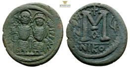 Justin II, with Sophia (565-578 AD). Nicomedia, AE Follis (31,1 mm 12,8 g)Obv: D N IVSTINVS P P AVG. Nimbate figures of Justin and Sophia seated facin...