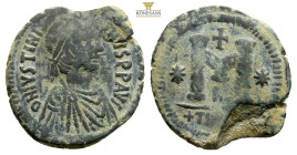 Justinian I. 527-565. AE Follis, 33,6 mm, 12,4 g, Theoupolis (Antioch) mint. Struck 533-537. Diademed and draped bust right / Large M; cross above, st...