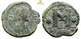 Justinian I. 527-565. AE Follis, 32,9 mm, 13,2 g, Theoupolis (Antioch) mint. Struck 533-537. Diademed and draped bust right / Large M; cross above, st...