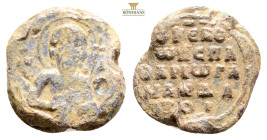 Byzantine Lead Seal Obv: Bust of Saint facing. Rev: Legends in five lines. 24,3 g. 11,5 mm.