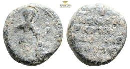 Byzantine Lead Seal, 14,1 g. 22,4 mm.
Saint Demetrios, with halo, standing, wearing short chiton and khlamys from the front. He is dressed as a soldi...