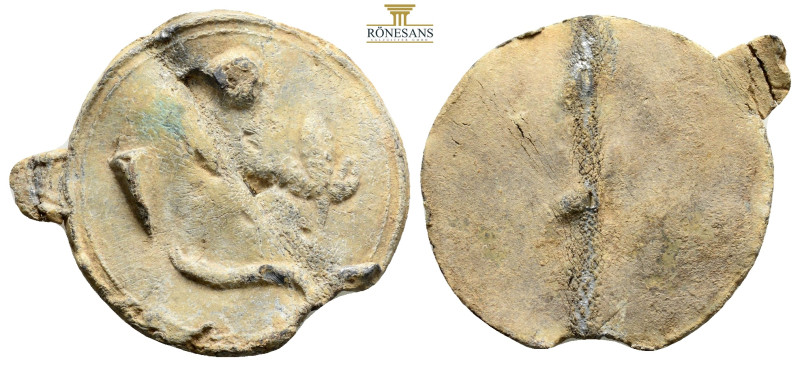 It depicts a triton holding a fish in his left hand. However, it was corroded be...