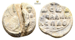 Obverse bust of Mary, from the front, with the child Jesus on her left arm, pointing to Jesus with her right hand (Mary Hodeghetria). The maphorion on...