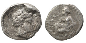 GREEK. Obol (silver, 0.63 g, 9 mm). Head right. Rev. Female figure (?) seated left. Nearly very fine.