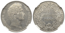 Bayern. Königreich (1806 - 1918). Ludwig I. (1825 - 1848).

 Gulden (Silber). 1845. München.
NGC AU (5883304-013).

Vs: Kopf rechts.
Rs: Wertang...