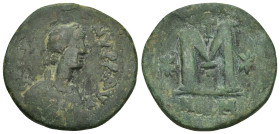 JUSTIN I.(518-522).Nicomedia.Follis.

Obv : DN IVSTINVS PP AVG.
Diademed, draped and cuirassed bust right, cross above.

Rev : Large M, cross above, s...