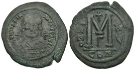 JUSTINIAN I (527-565).Constantinople. Follis.

Obv: D N IVSTINIANVS P P AVG.
Helmeted and cuirassed bust facing, holding globus cruciger and shield de...