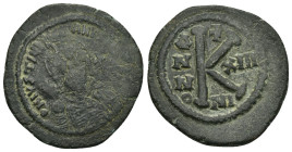 JUSTINIAN I (527-565).Nicomedia. Half Follis. 

Obv : D N IVSTINIANVS P P AVG.
Helmeted and cuirassed bust facing, holding globus cruciger and shield ...