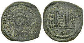 JUSTINIAN I (527-565).Constantinople. Half Follis. 

Obv : D N IVSTINIANVS P P AVG.
Helmeted and cuirassed bust facing, holding globus cruciger and sh...