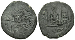 JUSTINIAN I (527-565).Theoupolis (Antioch). Follis. 

Obv : D N IVSTINIANVS P P AVG.
Helmeted and cuirassed bust facing, holding globus cruciger and s...