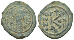 JUSTINIAN I.(527-565).Constantinople.Half Follis.

Obv : D N IVSTINIANVS P P AVG.
Diademed, helmeted, and cuirassed facing bust, holding globus crucig...