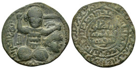 ARTUQIDS.Husam Ad-Din Yuluq-Arslan.1184-1201 AD.No mint.596 AH.AE Dirham.

Obv : Perseus seated with sword behind his head and holding the head of Med...