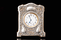 Swiss clock, silver plated metal. Pocket watch by Doxa. The clock is set in a beautiful silver frame. The frame has the English stamps, Birmingham. Th...