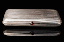 Silver cigarette case 875. Moscow, USSR. 1930th. Gilding. Push button with garnet cabochon. The size 10,5x8 cm and weight 196 gr.
Used