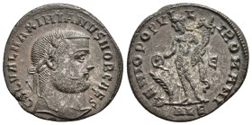 IMPERIO ROMANO. GALERIO MAXIMIANO. Follis. Alejandría (289-299). A/ Cabeza laureada a der.; GAL VAL MAXIMIANVS NOB CAES. R/ Genio a izq. con pátera y ...